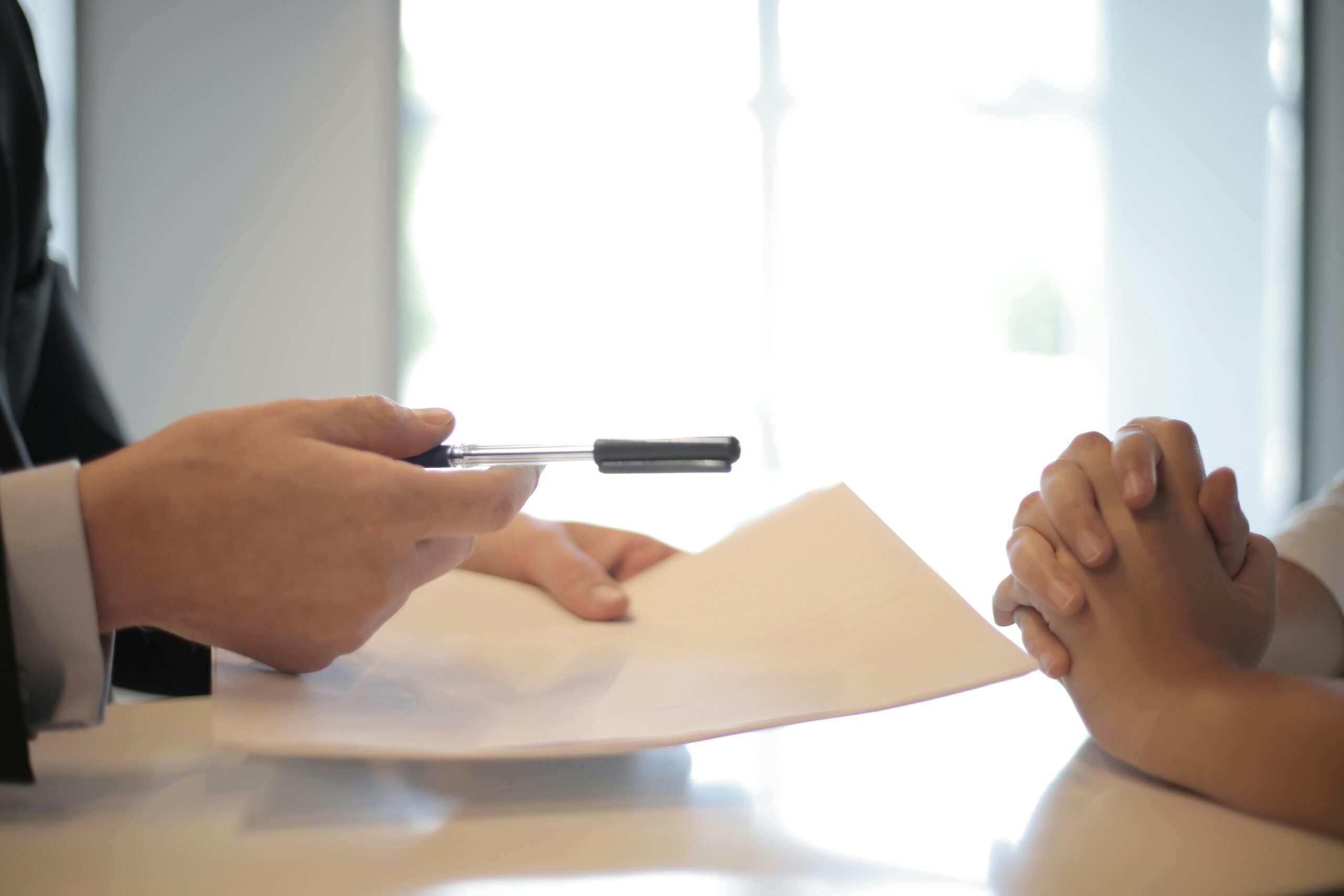 insurance meeting with paper being signed